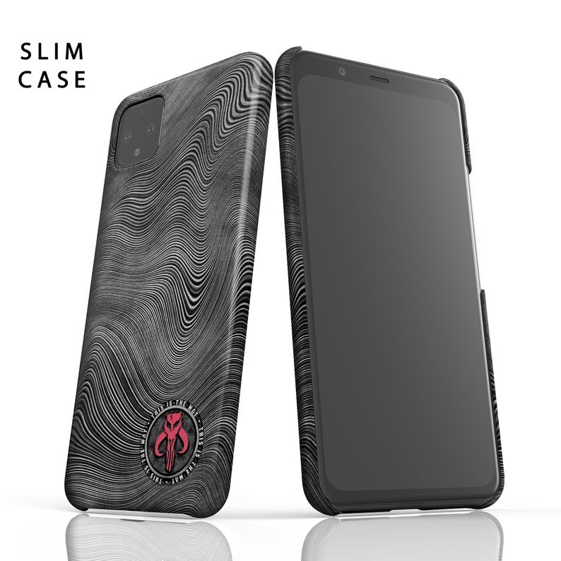 May include: Two black and gray slim phone cases with a wavy pattern. One case is leaning against a smartphone. The case features a red emblem with the text "THIS IS THE WAY". The text "SLIM CASE" is at the top left.
