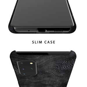 May include: A black phone case with a wood grain pattern. The case is designed to fit a phone with a single camera lens.