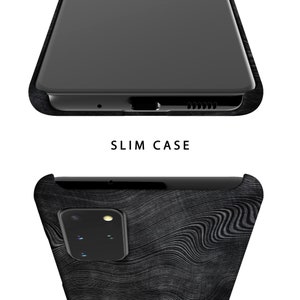 May include: A black phone case with a wood grain pattern. The case is designed to fit a phone with a single camera lens.