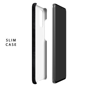 May include: A black phone case with a wood grain pattern. The case is shown with a white phone inside. The case is slim and fits snugly around the phone.