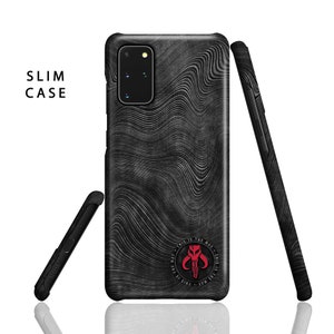 May include: A black phone case with a wavy pattern and a red Mandalorian symbol with the text "This is the way" around it. The case is designed for a Samsung Galaxy S20.