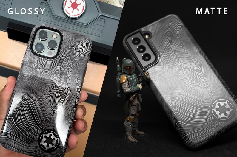 May include: Two phone cases with a black and white wavy pattern. The case on the left is glossy and the case on the right is matte. Both cases have a black and white symbol in the lower right corner.