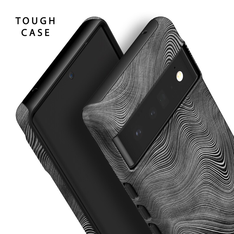 May include: Close-up of two black phone cases. The cases have a textured, wavy pattern in shades of gray and black. The text "TOUGH CASE" is in white letters in the upper left corner. The phone's camera and screen are visible.