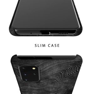 May include: A black phone case with a wood grain pattern. The case is designed to fit a phone with a single camera lens.