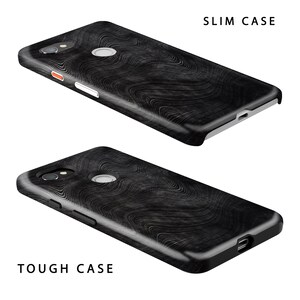 May include: Two phone cases with a black and white wood grain pattern. The top case is labeled "SLIM CASE" and the bottom case is labeled "TOUGH CASE".
