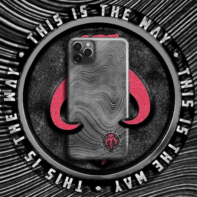 May include: A black and white phone case with a wavy pattern. The case has a Mandalorian symbol on the back with the text "This is the way".