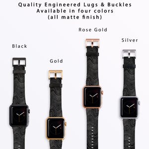 May include: Four Apple Watch bands with different colored clasps: black, gold, rose gold, and silver. Each band has a black and white patterned design.