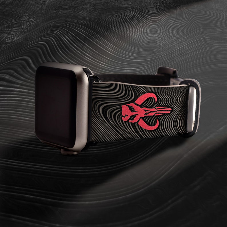 May include: A black and red Apple Watch band with a swirling pattern and a Mandalorian symbol.