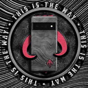May include: A phone case with a gray, wave-patterned design and the text "THIS IS THE WAY" in white. The case features a red emblem and a circular logo with the text "THIS IS THE WAY".