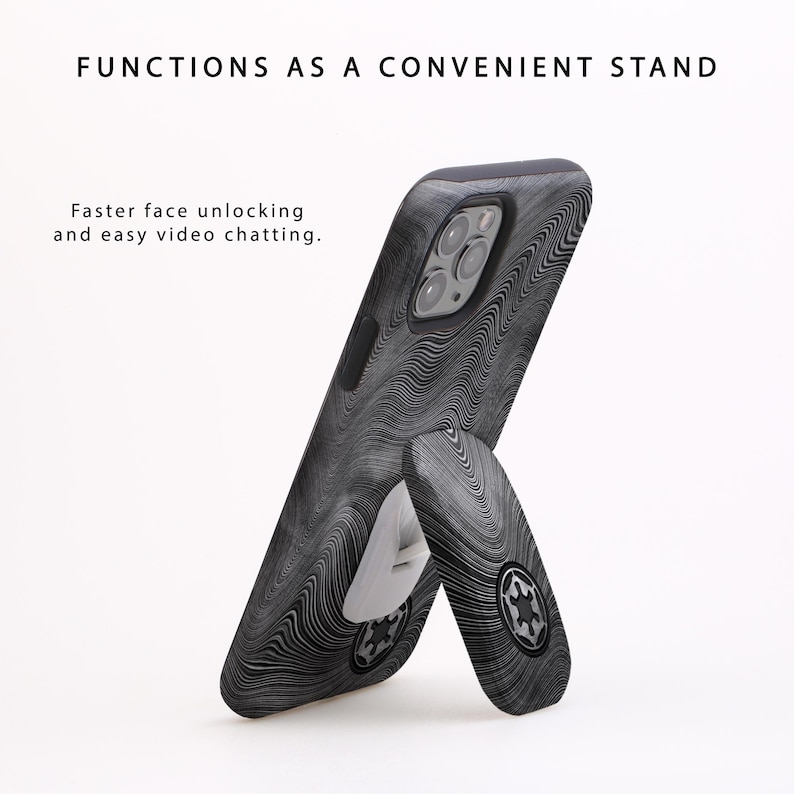 May include: A black and gray phone case with a wave pattern, propped up as a stand. The case has a built-in kickstand with a circular emblem. Text on the image reads "Functions as a convenient stand" and "Faster face unlocking and easy video chatting."
