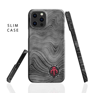 May include: A black and white slim phone case with a wavy pattern. The case has a red and black Mandalorian symbol with the text "This is the way" around it.