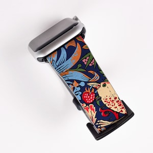 May include: A silver Apple Watch with a blue, orange, and white patterned band featuring a bird and floral design.