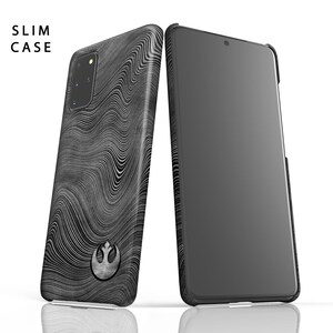 May include: A black phone case with a white Rebel Alliance symbol and a wavy pattern. The case is designed for a slim fit and has a black screen protector.
