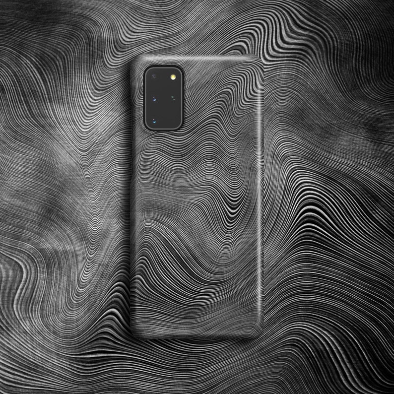 May include: A black phone case with a white wavy pattern. The case has a camera lens cutout in the upper left corner.