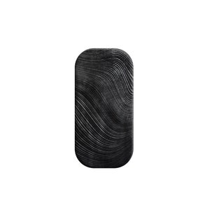 May include: Black and white striped rectangular shape with rounded edges. The stripes are wavy and create a wood-like pattern.