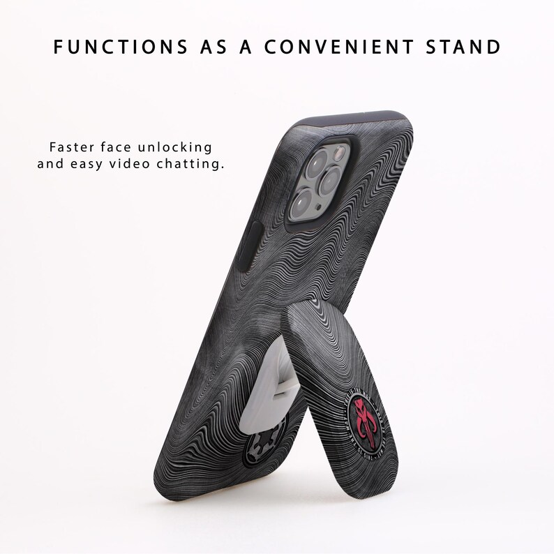 May include: A black phone case with a white and black swirl pattern. The case has a built-in kickstand that can be used to prop up the phone for hands-free viewing.