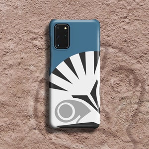May include: A blue phone case with a white and black geometric design. The design features a stylized fan shape with a gray circle in the center.