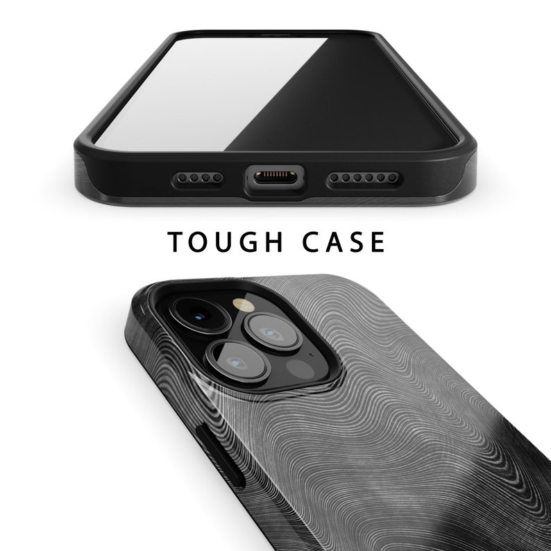 May include: A black phone case with a white wood grain pattern. The case has a raised camera bump and a cutout for the phone's charging port. The text "TOUGH CASE" is printed on the case.