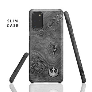 May include: A black phone case with a Rebel Alliance symbol and a wavy pattern. The case is labeled "SLIM CASE".