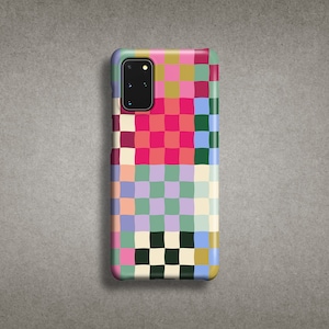 May include: A colourful phone case with a checkered pattern in shades of pink, green, blue, and yellow. The case has a cutout for the camera lens.