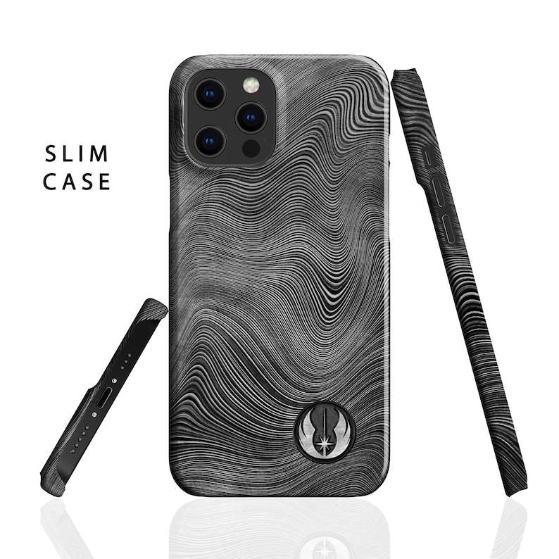 May include: A black phone case with a white and gray wavy pattern and a Rebel Alliance symbol. The case is designed to fit a smartphone with a camera bump.