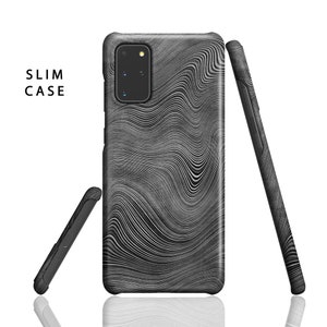 May include: A black phone case with a wavy, abstract pattern. The case is slim and has a cutout for the camera lens.