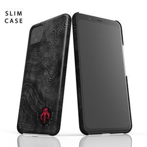 May include: A black phone case with a wavy pattern and a red Mandalorian symbol. The case is designed to fit a slim phone. The text "This is the way" is printed around the symbol.