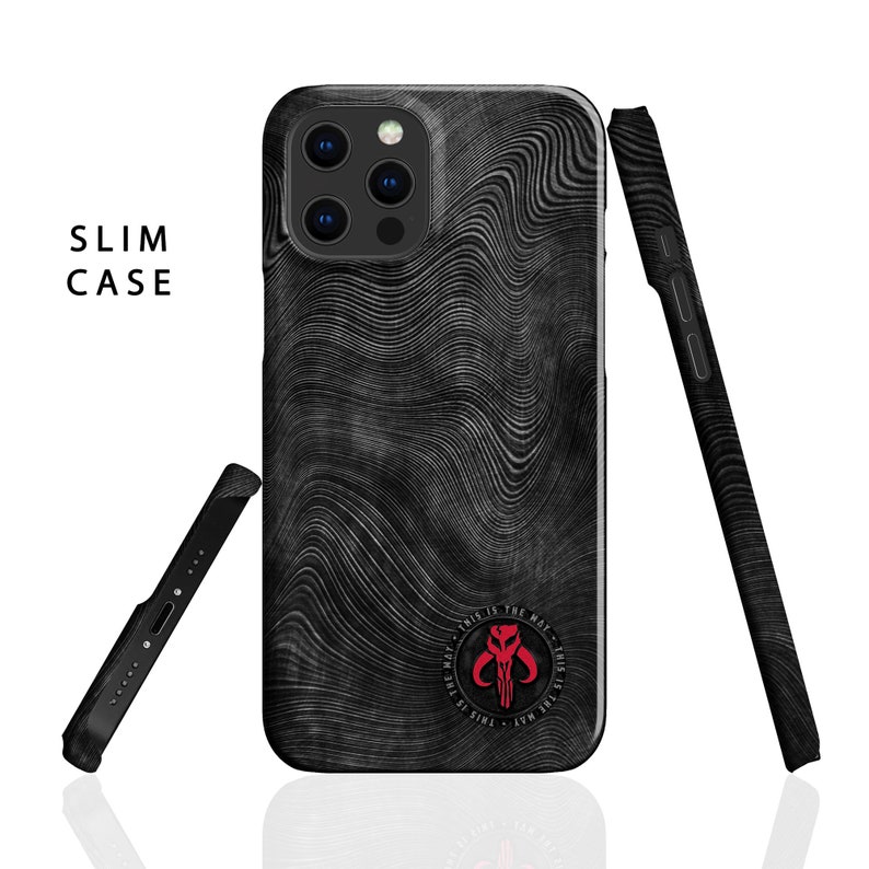May include: A black phone case with a wavy pattern and a red Mandalorian symbol. The text "This is the way - This is the way" surrounds the symbol.