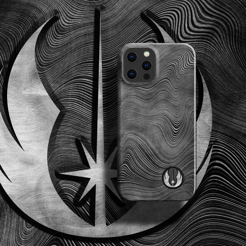 May include: A black and white phone case with a wavy pattern and a Star Wars Rebel Alliance symbol. The case has a black camera bump with five camera lenses.