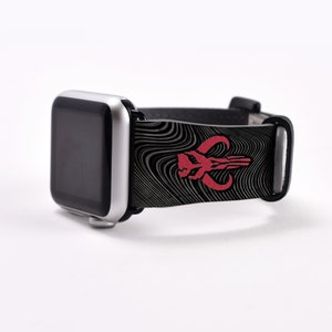 May include: A black Apple Watch band with a red Mandalorian symbol and a black and white wavy pattern.