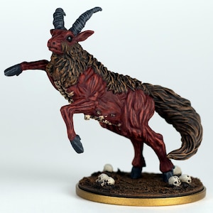 May include: A detailed miniature figurine of a mythical creature, a goat-like beast with dark red fur and black horns. The figure has a long, flowing tail and is posed mid-leap, with small skulls scattered around its base.