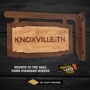 Puede incluir: Un letrero de madera con el texto "KNOXVILLE, TN." El letrero está montado en un soporte de madera y está diseñado para montarse en una pared con tornillos estándar. El letrero está hecho de madera contrachapada de 3,2 mm. Se incluyen archivos de corte láser digital.