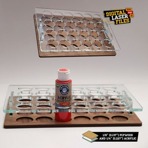 May include: A two-tiered acrylic paint organizer made from 1/8 inch plywood and 1/4 inch acrylic. The organizer has 24 round slots for paint bottles. The top tier is removable.  The organizer is shown with a red acrylic paint bottle.
