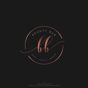 May include: A rose gold logo on a black background. The logo features the words "BEAUTY BAR" in a circular design, with "bb" in the center. Below, it reads "HAIR &bull; NAILS &bull; MAKEUP". The logo is for a beauty business.