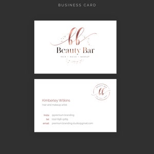 May include: Two white business cards with a rose gold logo and text. The top card reads "Beauty Bar" with "Hair, Nails, Makeup" below. The bottom card includes contact information for Kimberley Wilkins, a hair and makeup artist.