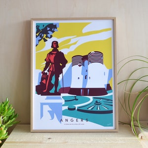 Puede incluir: L&aacute;mina art&iacute;stica enmarcada con una ilustraci&oacute;n estilizada de Angers, Francia. La obra representa una estatua, un castillo y el texto "ANGERS". La paleta de colores incluye amarillo, azul, rojo y blanco. La impresi&oacute;n est&aacute; en un marco de madera.