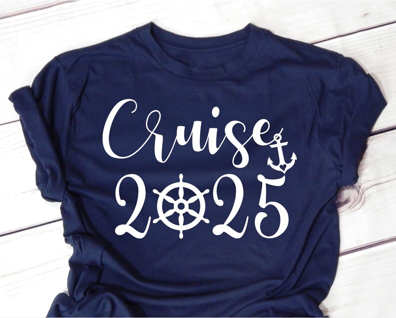 May include: A navy blue t-shirt with white text that reads "Cruise 2025" and a white anchor graphic.