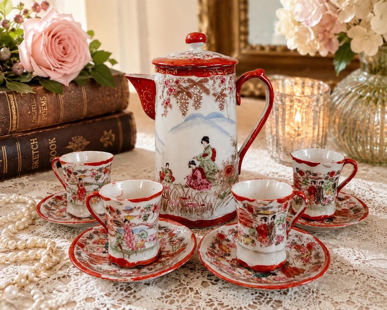 May include: A porcelain tea set featuring a tall teapot with a lid and four matching cups and saucers. The white ceramic pieces are decorated with colorful hand-painted scenes of figures in traditional attire, floral motifs, and red trim accents.