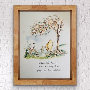 May include: A watercolor illustration of Winnie the Pooh and Piglet walking through a forest. The quote "When life throws you a rainy day, play in the puddles." is written below the image.