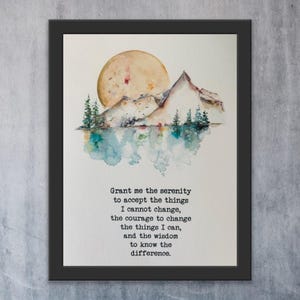 May include: Framed watercolor art print featuring a mountain landscape with a large sun and trees reflected in the water. The artwork includes the text "Grant me the serenity..." in a black frame.