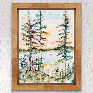 May include: Watercolour painting of a lake scene with three tall pine trees in the foreground and a small boat on the water. The sky is a soft pink and blue with clouds. The trees are painted in shades of green and brown.