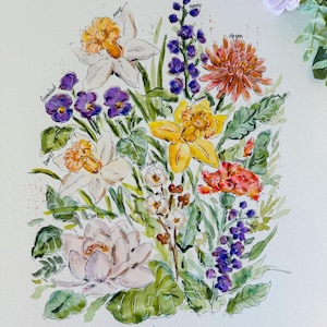 May include: A watercolor painting of a bouquet of flowers with each flower representing a family member. The flowers include daffodils, carnations, pansies, lilies, and a chrysanthemum. The text "The Holl Family" is written at the bottom of the painting.