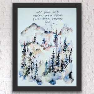 May include: A framed watercolour painting depicting a mountain scene with trees in blues, greens, and pinks. The black framed artwork includes the text: "add your own custom song, lyric, quote, poem, saying here."