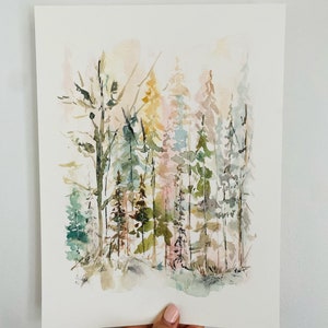 May include: Watercolor painting of a forest scene with a variety of trees in shades of green, blue, pink, and yellow. The trees are painted in a loose, impressionistic style, creating a sense of depth and movement.