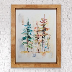 May include: A framed watercolour painting depicting a forest scene. The artwork showcases trees in shades of blue, green, orange, and brown. The wooden frame is light brown. The painting evokes a sense of nature and tranquility.