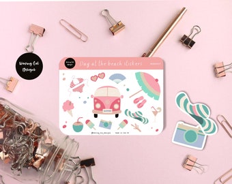 May include: A sheet of stickers featuring a pink and white van with the word "Summer" on it, a beach umbrella, sunglasses, a fan, a coconut, ice cream, a camera, and a straw hat. The stickers are on a white background with the text "Day at the beach stickers" and "WCD00001" at the top.