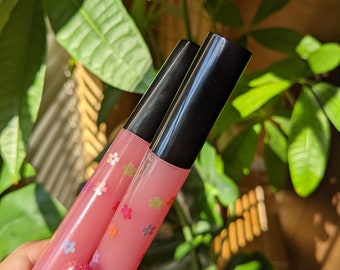 Raspberry scented lipgloss with Flowers, blossom 1 only