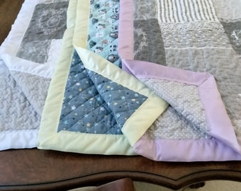 Baby Quilt with satin trim 100% hand made.  Print on both sides.