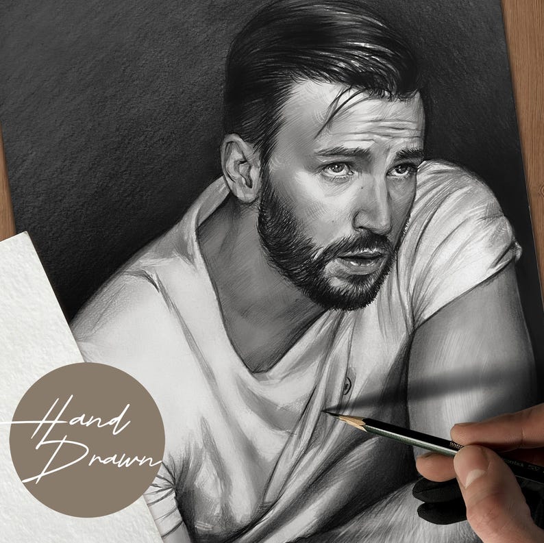 May include: A hand-drawn charcoal portrait of a man with a beard, wearing a white t-shirt. The artwork is in grayscale, with the text "Hand Drawn" in a circular design. A hand holds a pencil, adding detail to the drawing.