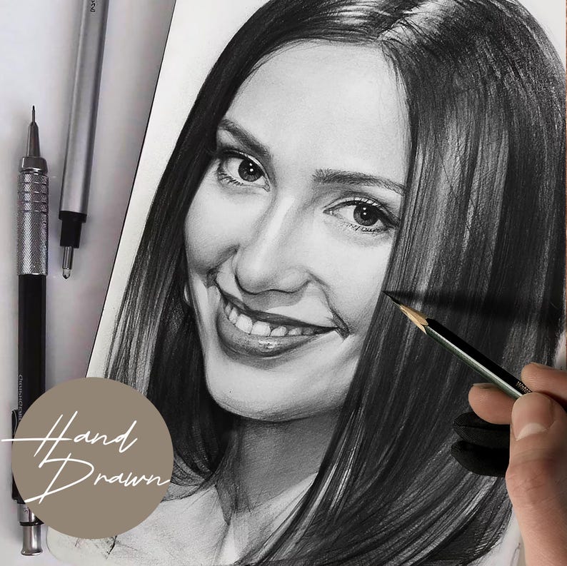 May include: A detailed, hand-drawn portrait of a smiling person with long, dark hair. The artwork is in grayscale, with pencils and the text "Hand Drawn" visible. The portrait is on white paper, with a hand holding a pencil.